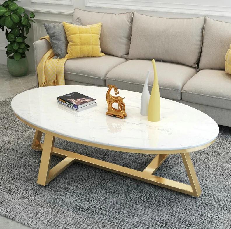 Serina Oval Sintered Stone top Coffee Table/ Golden coloured legs/steel frame